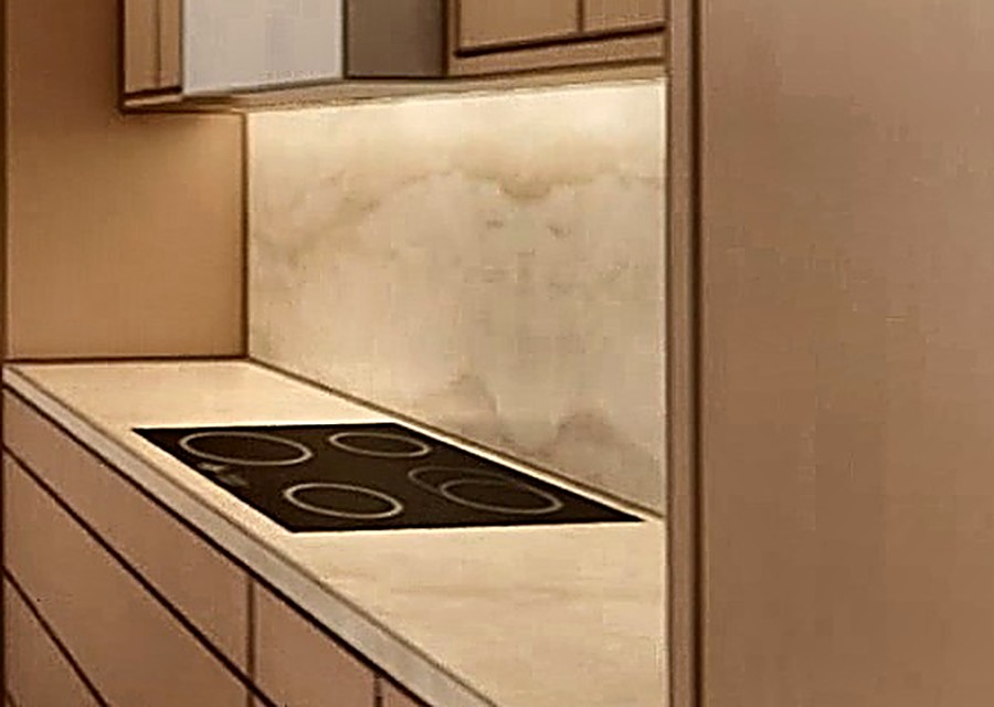 Honed quartz counters with waterfall island
